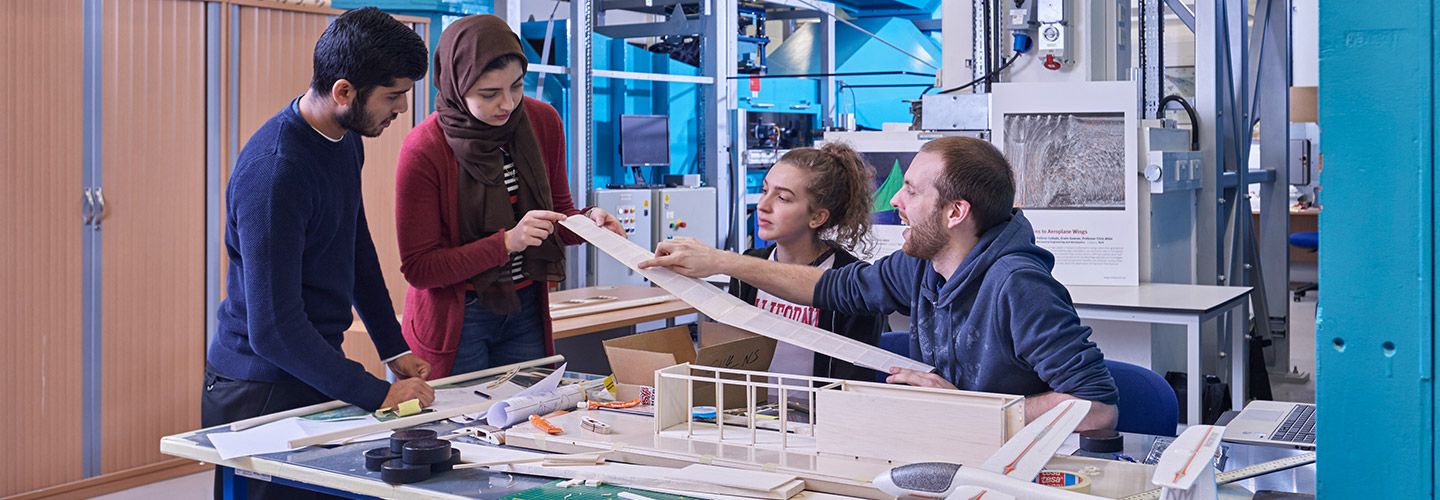 Students working together on a construction prototype