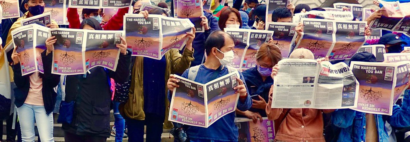 Hongkongers queue to buy a copy of the last-ever edition of Apple Daily