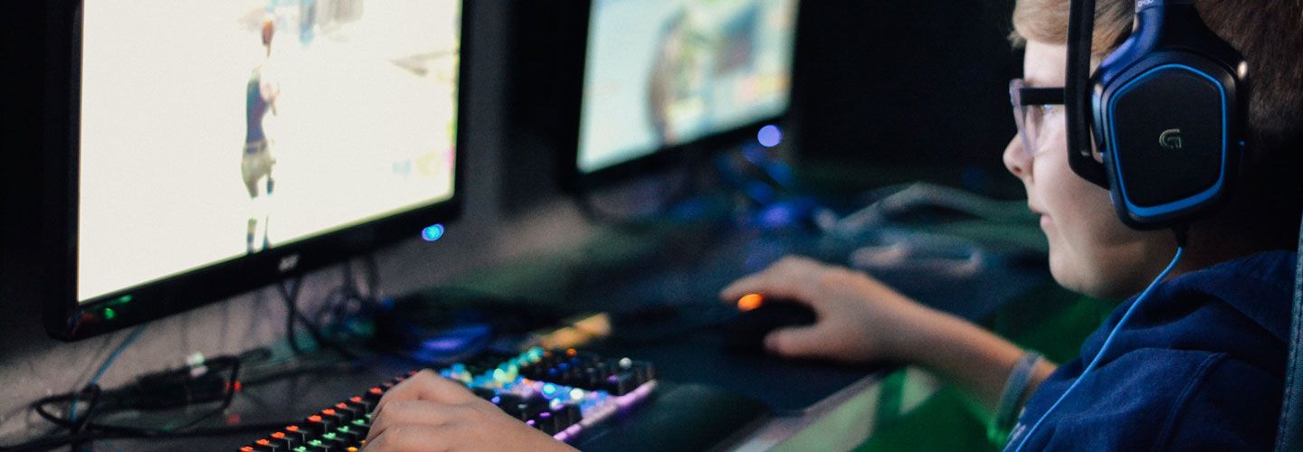 Young male gamer playing a war game