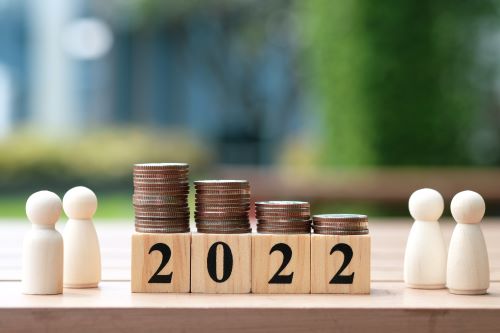 Money sitting atop a 2022 sign