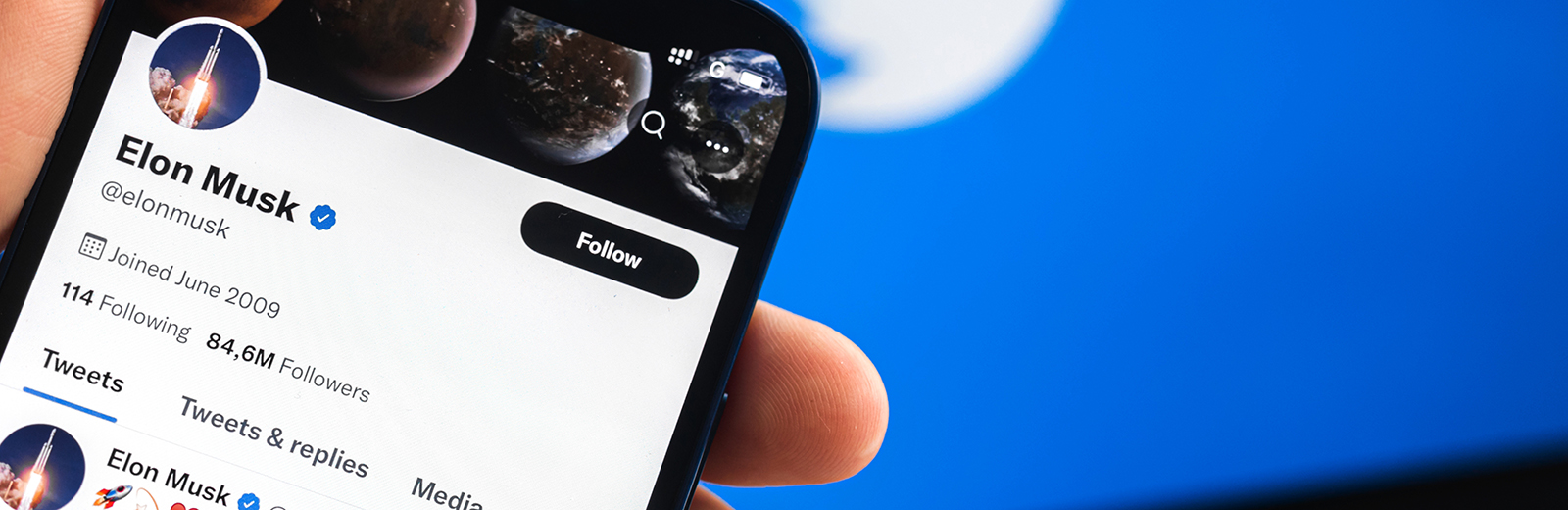 Mobile phone with Elon Musk's Twitter profile on screen