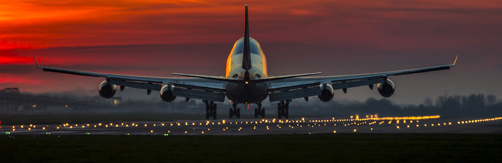 Aeroplane taking off into night sky