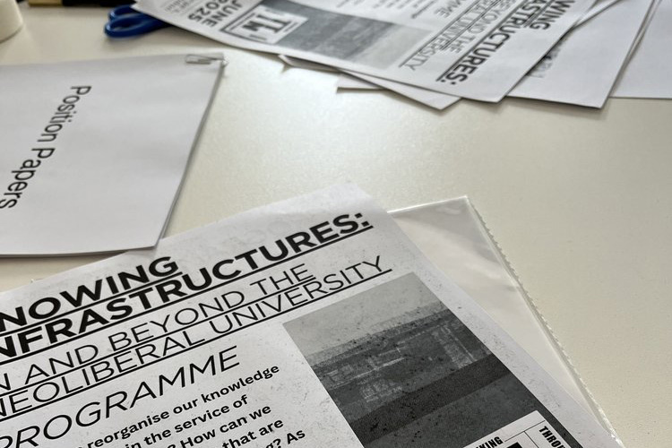 Close up on scattered printed programmes.