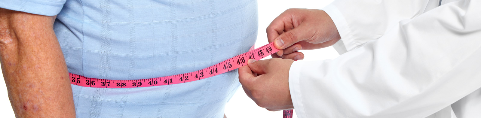 Doctor measuring a patient's waist