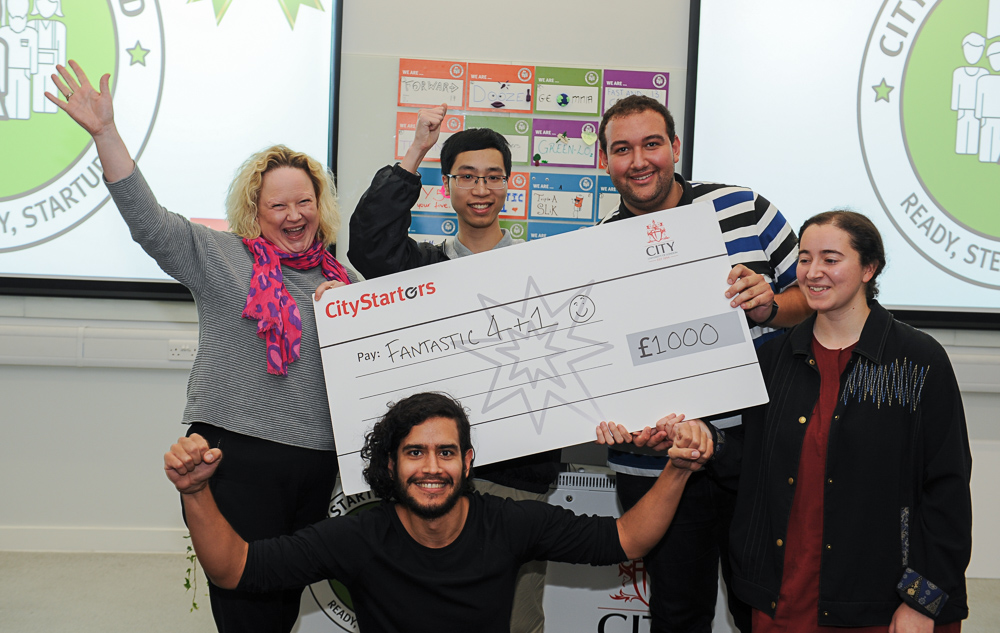 Fantastic 4 + 1 team holding their CityStarters cheque presented by Caroline Wilson
