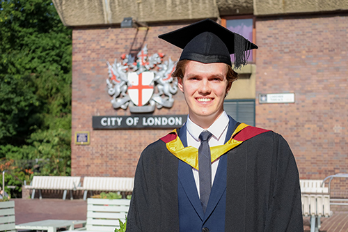 Michael Stanik in graduation robes