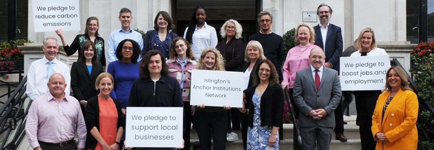 City and other leaders stand together at council offices 