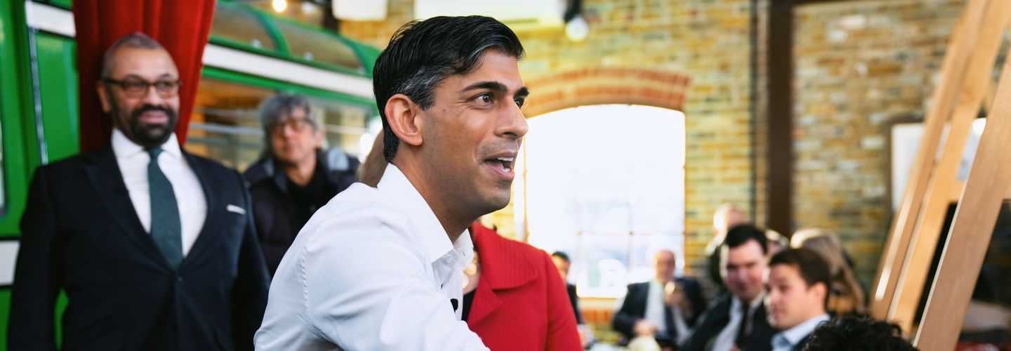 Rishi Sunak shakes hands while campaigning