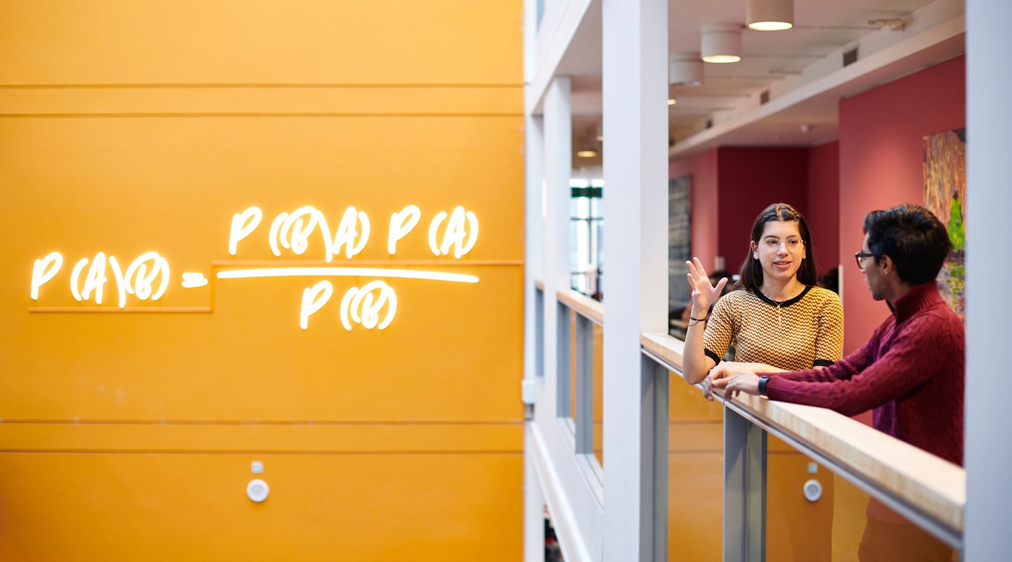 The Bayes theorem written on a yellow wall 
