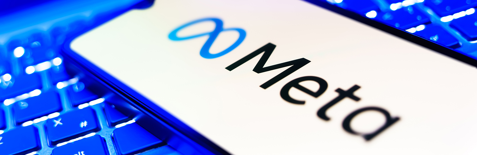 Meta logo on a blue keyboard