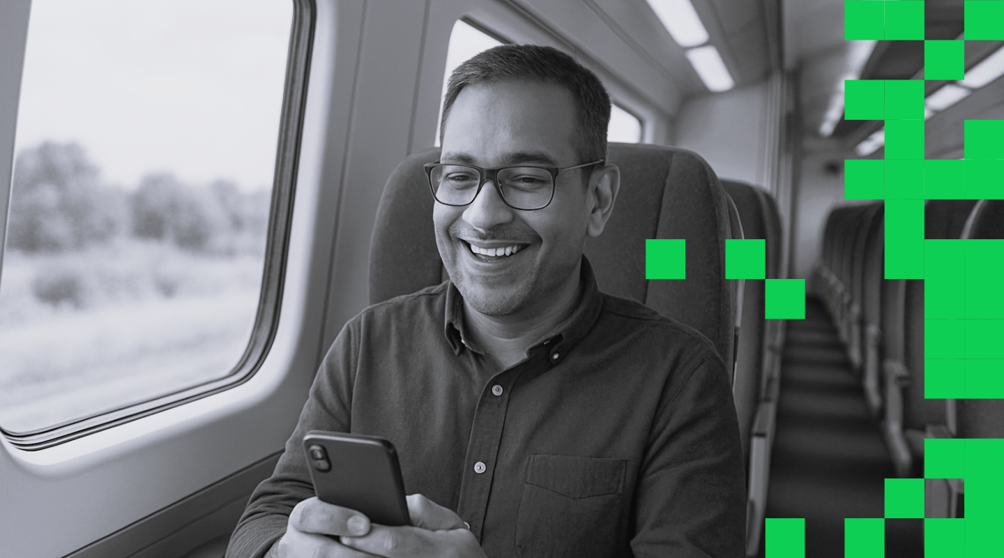 Man looking at his phone on the train.