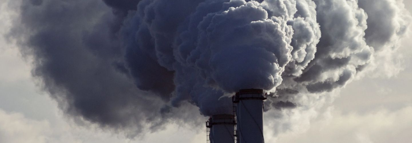 Air pollution spewing from power plant chimneys 