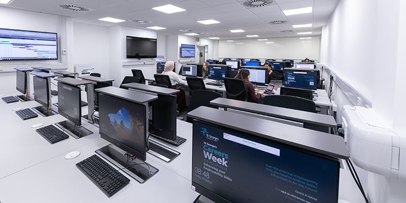 Computers on desks in computer room