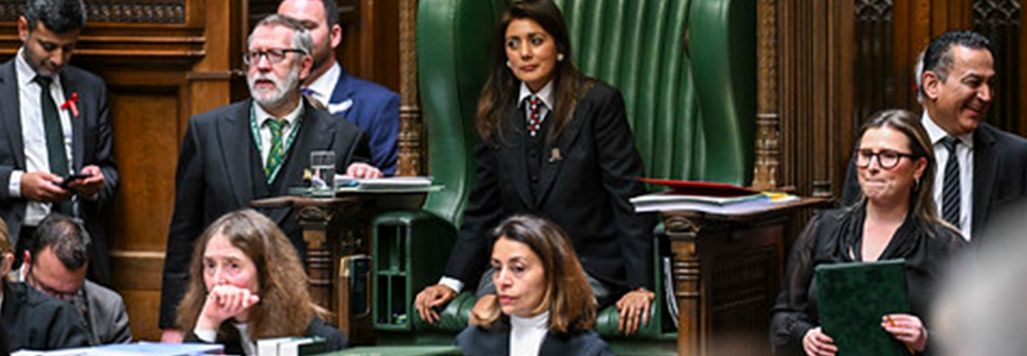 7-8 officials and MPs, including the female deputy speaker, react to what is being said in the Chamber 