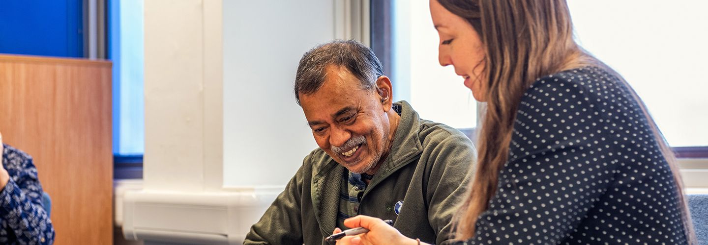 Female student and male research participant smiling