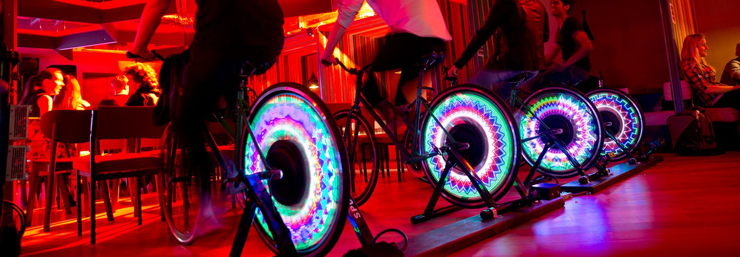 Students on bicycle powering a cinema