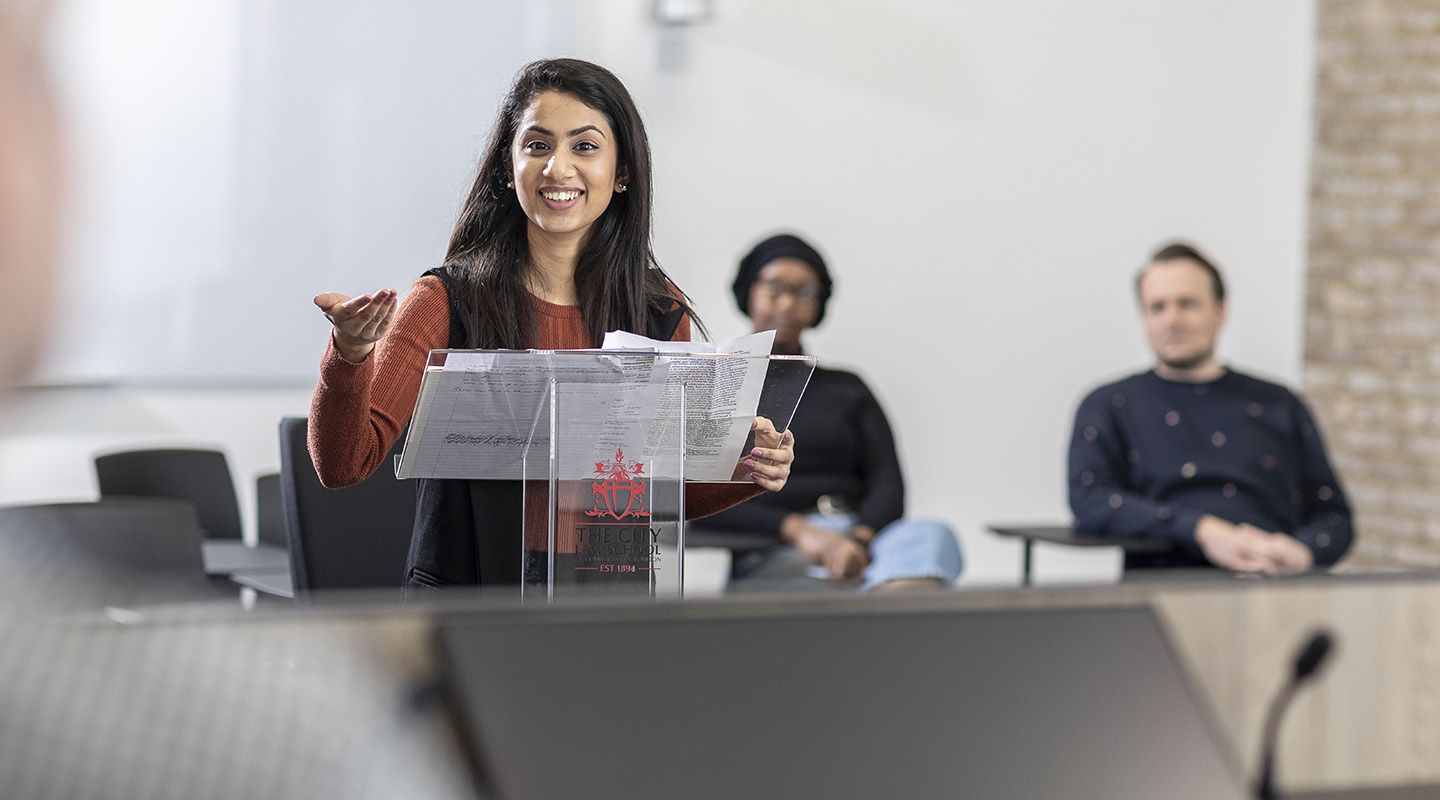 LLB Law student in the mock courtroom on the ground floor of The City Law School Building.