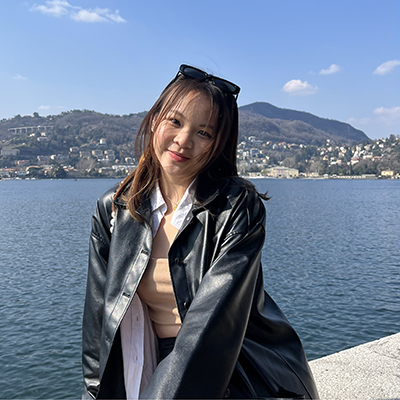 Bar Vocational Studies student Karway Kan standing for image with see and cliff in the background