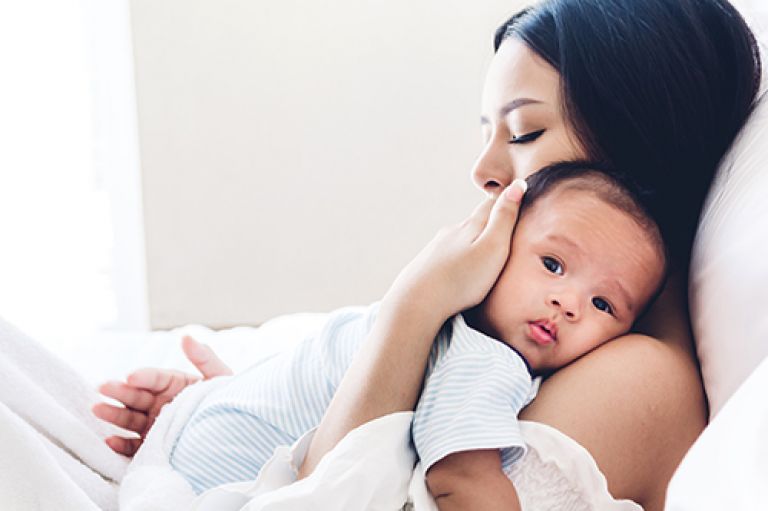mother and newborn child photo