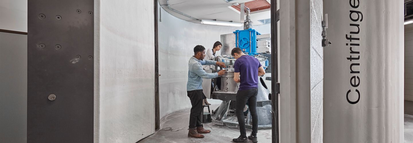 Students conducting an experiment at the centrifuge
