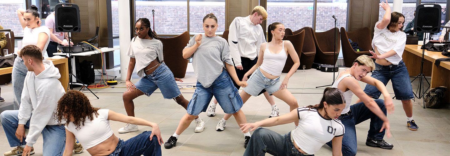 Image of students in the Pavilion on campus dancing