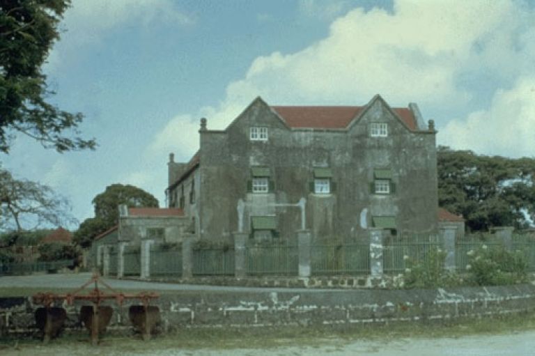 An image of Drax Hall Estate, a large colonial Jacobean building.