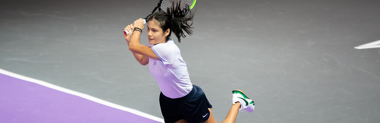 Emma Raducanu hitting a shot