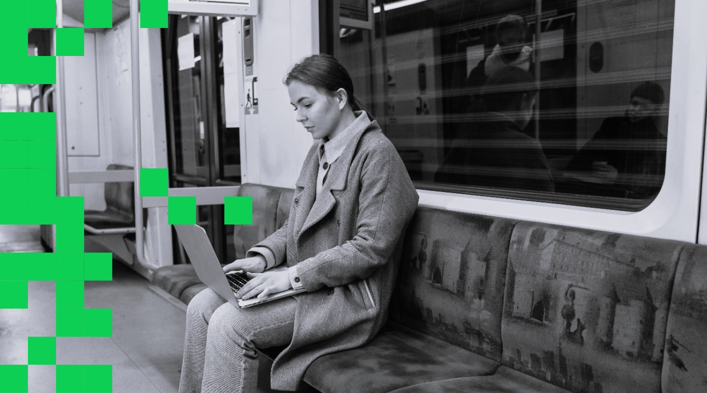 Woman on her laptop on a tube train