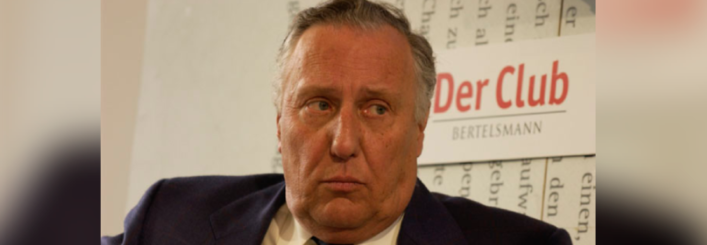 Frederick Forsyth is looking off to the right. The background says 