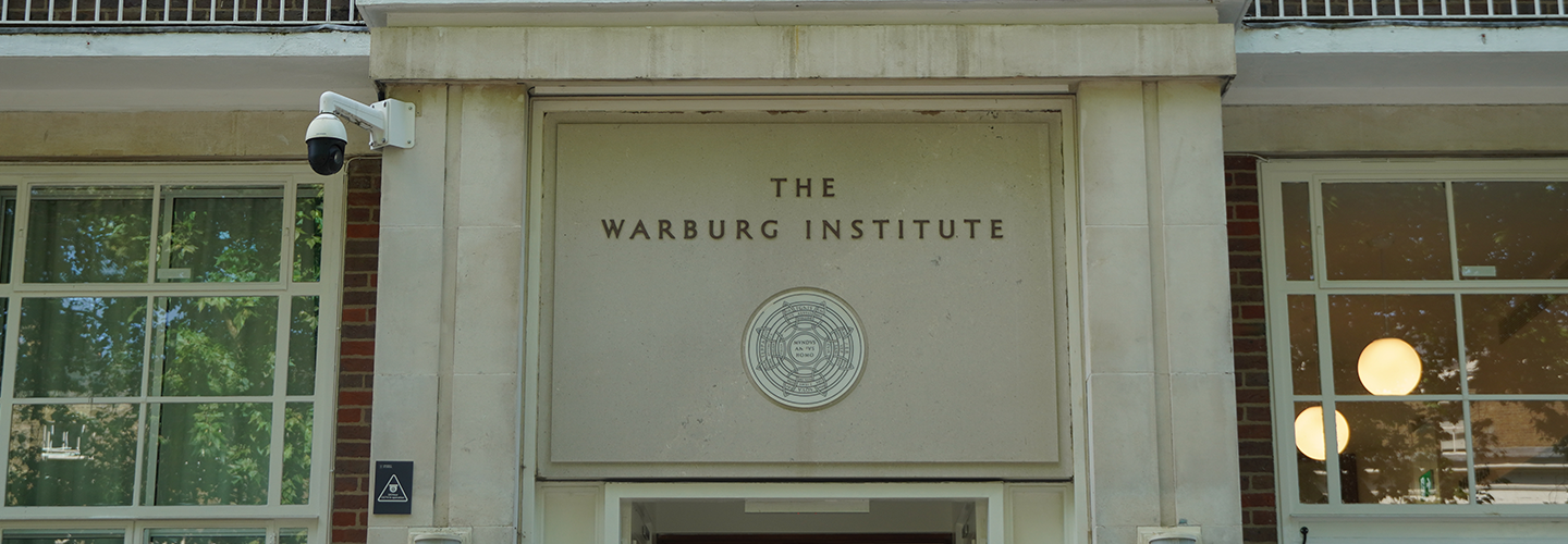 The exterior of an ornate building with large windows