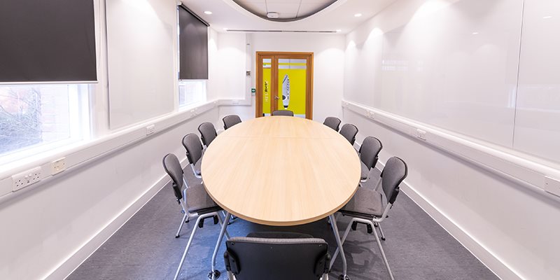 Empty base teaching room with chairs positioned round a table