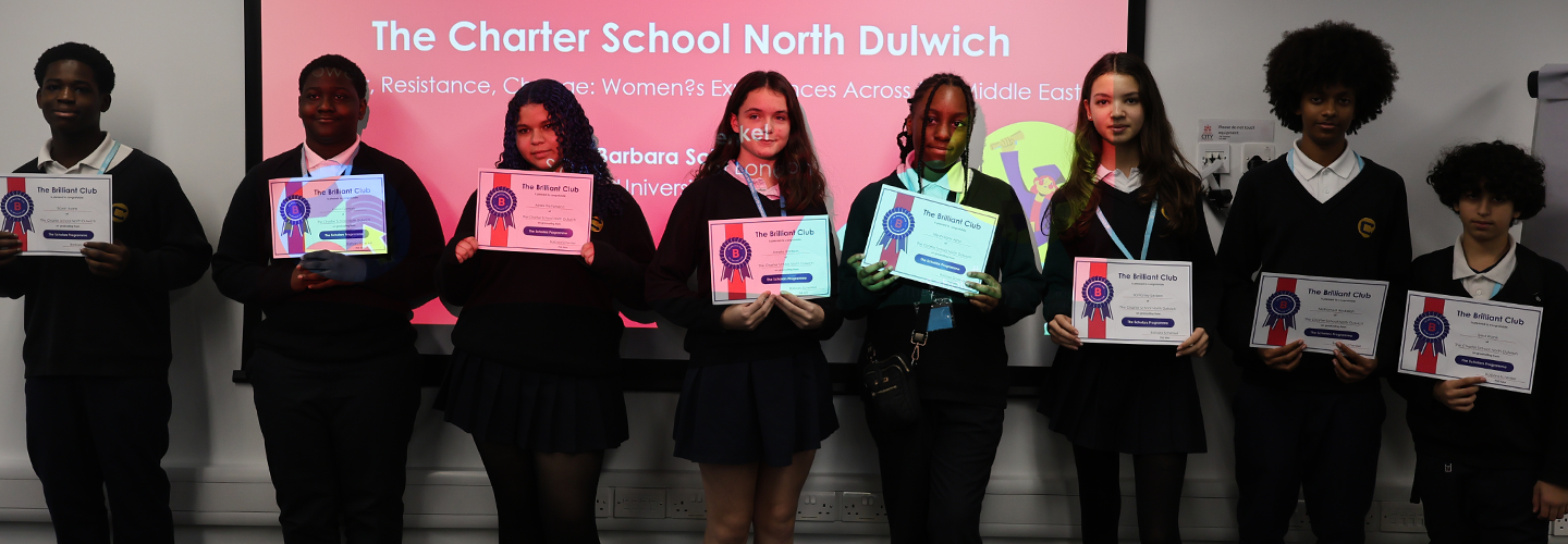 A group of school pupils pose with certificates