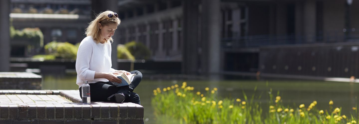 Female student reading a book