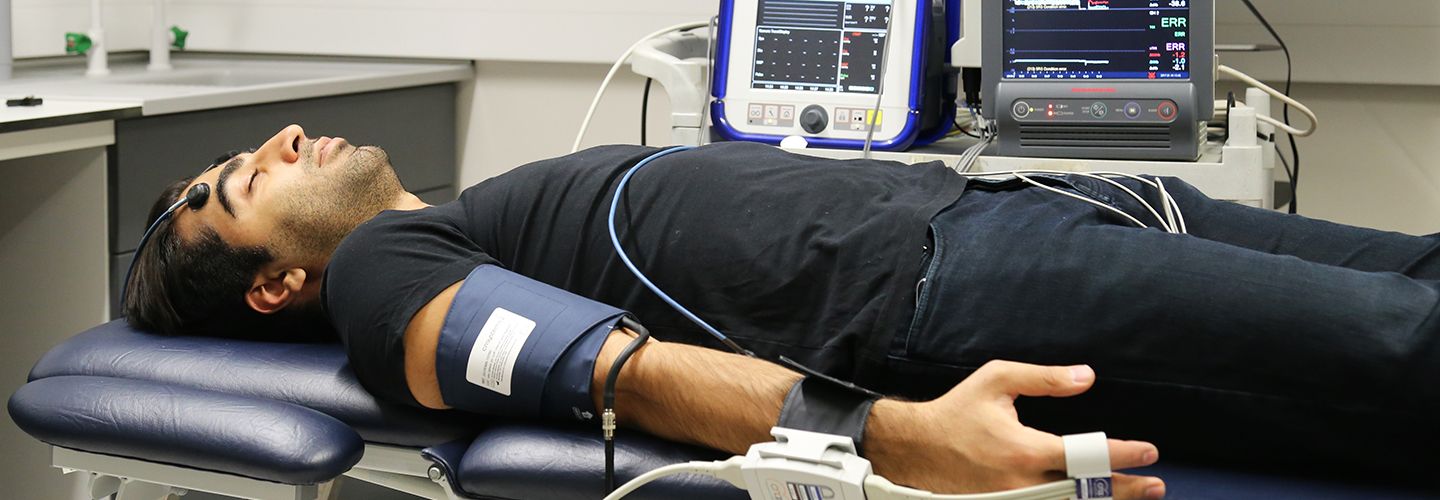 Pulse oximeter sensors attached to man laying down