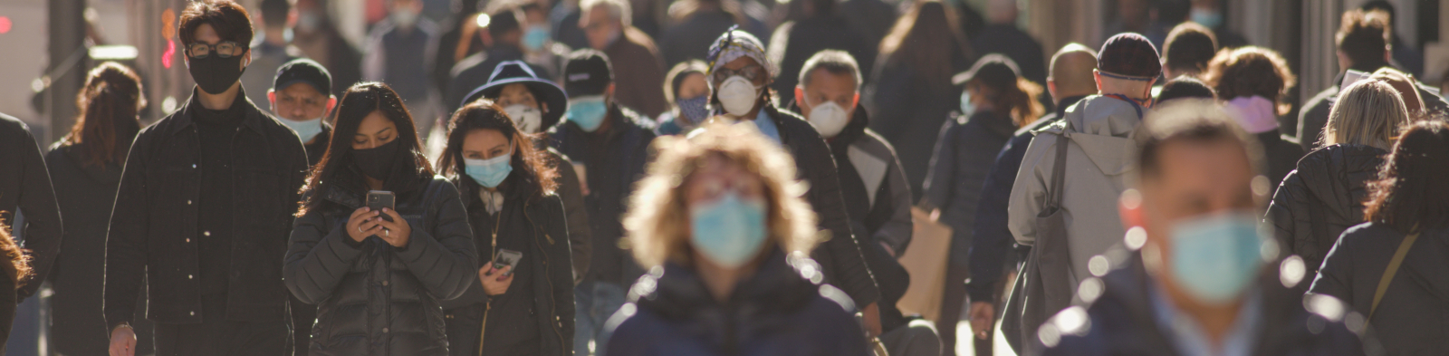 A group of people wearing masks