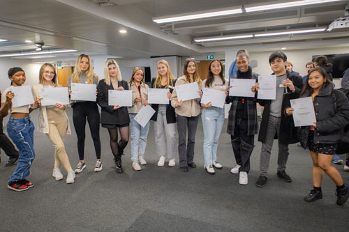 A group of students pose for a picture at the scholarship awards