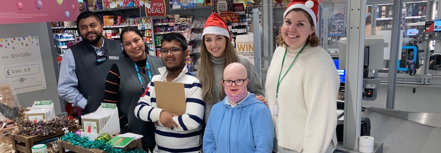 Paulina Samasova, (BSc Sociology with Psychology) works with staff at PiP's Christmas charity event. 