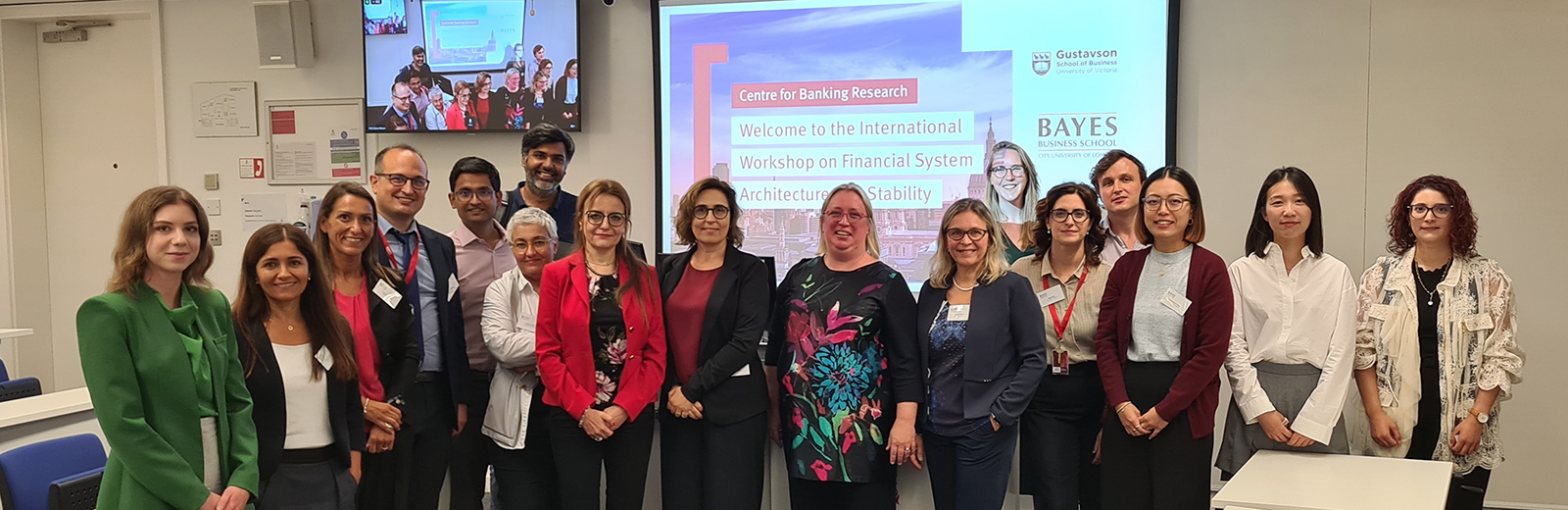 IWFSAS presenters lined up in front of a projector screen