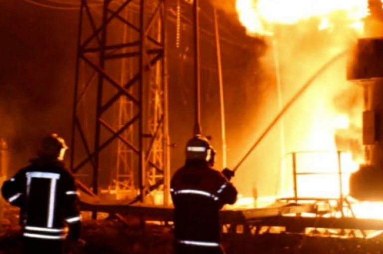 Firefighters work at a site of a thermal power plant damaged by a Russian missile strike, amid Russia's attack on Ukraine, in Kharkiv, Ukraine September 11, 2022.