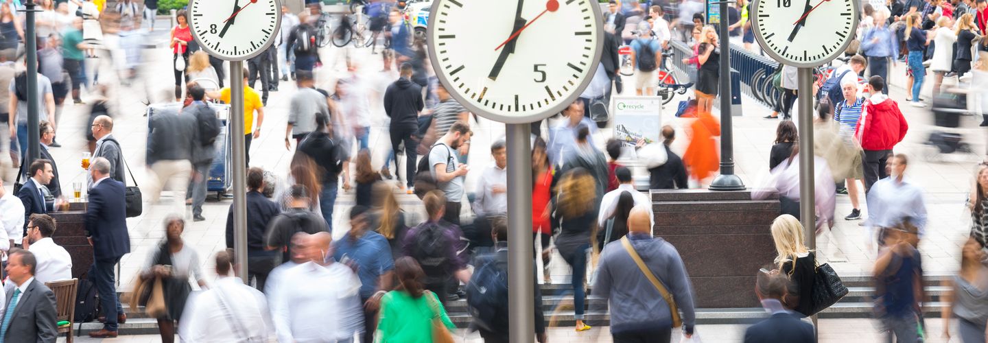 People walking through busy London streets.