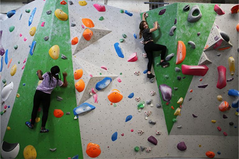 Schoolchildren bouldering at the Castle Climbing Centre