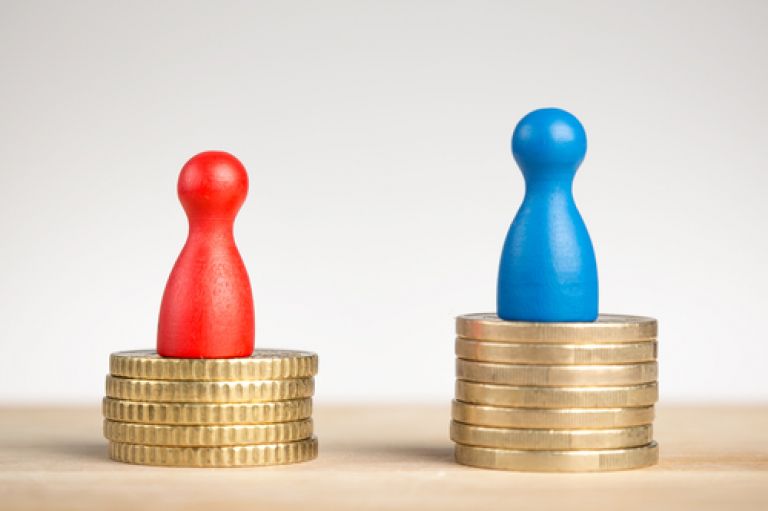 An image of two pawns -- one red symbolising women, and one bigger and blue symbolising men -- both placed on top on a column of coins. The blue pawn has a bigger column, signalling more wealth.