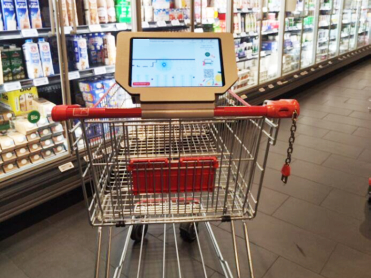 Shopping trolley with AI tablet attached to handlebar