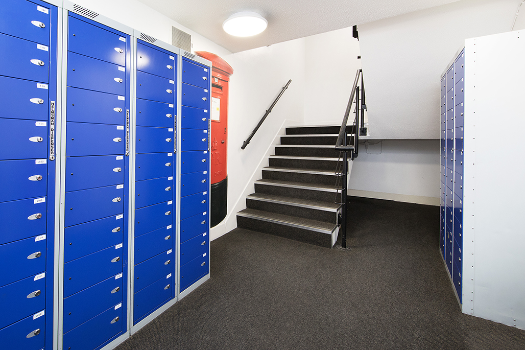Romano court post box lockers next to staircase