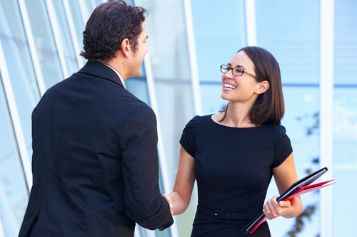Man and woman shaking hands
