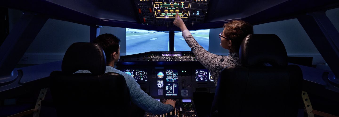 Students using a flight simulator