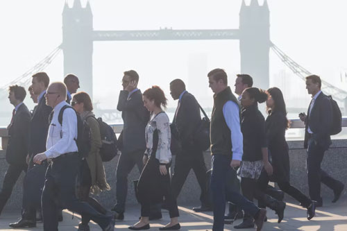 Workers crossing a London bridge