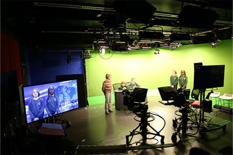 St John's Vale Church of England primary school children with Professor Emeritus Lis Howell at City's Journalism Department TV studio