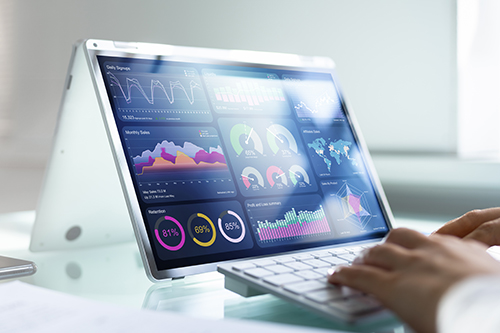 Person working on a tablet displaying data