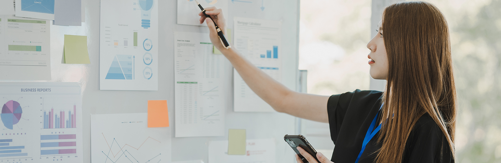 Female entrepreneur making plans on a wall